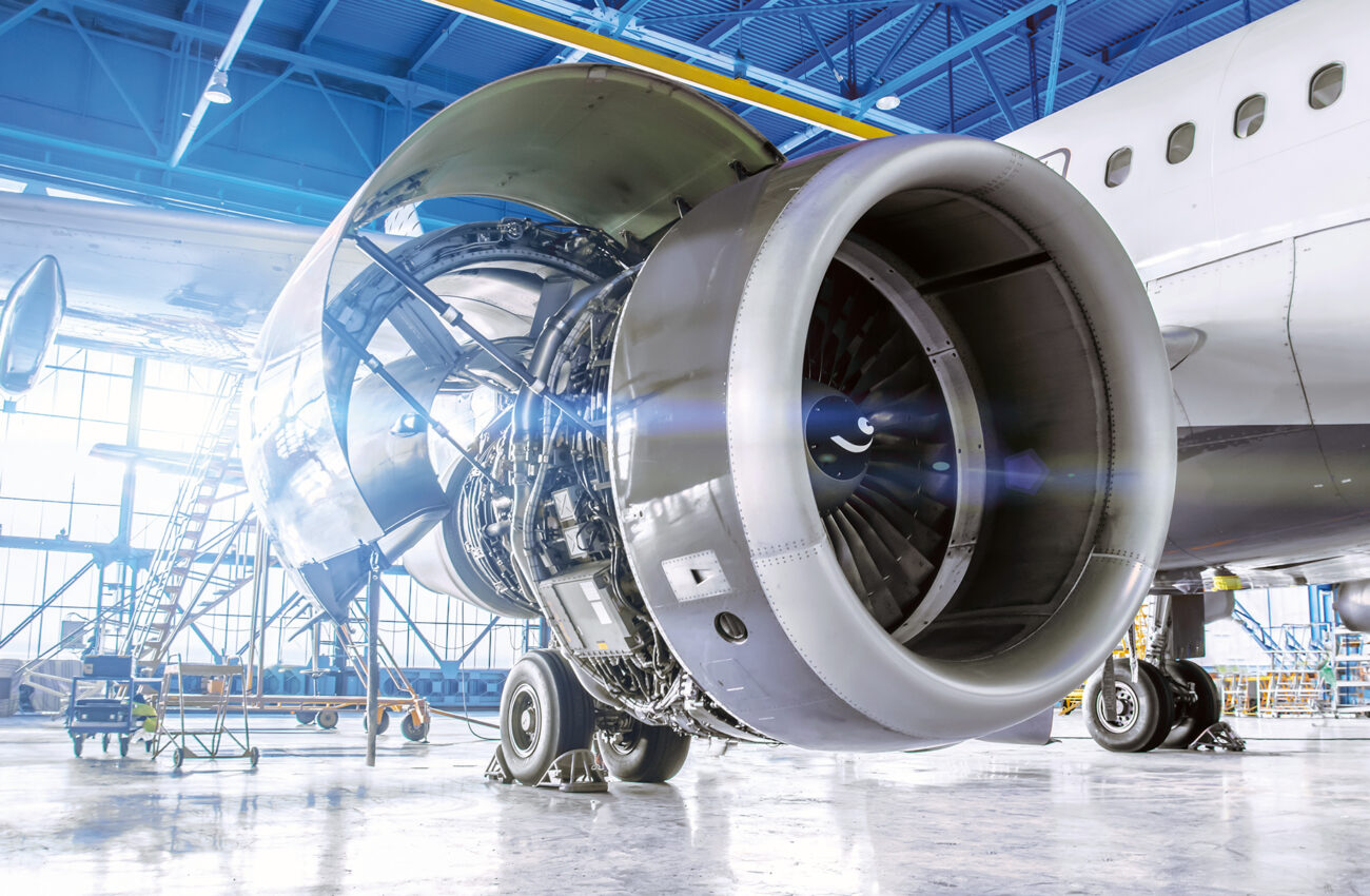 Industrial theme view. Repair and maintenance of aircraft engine on the wing of the aircraft.