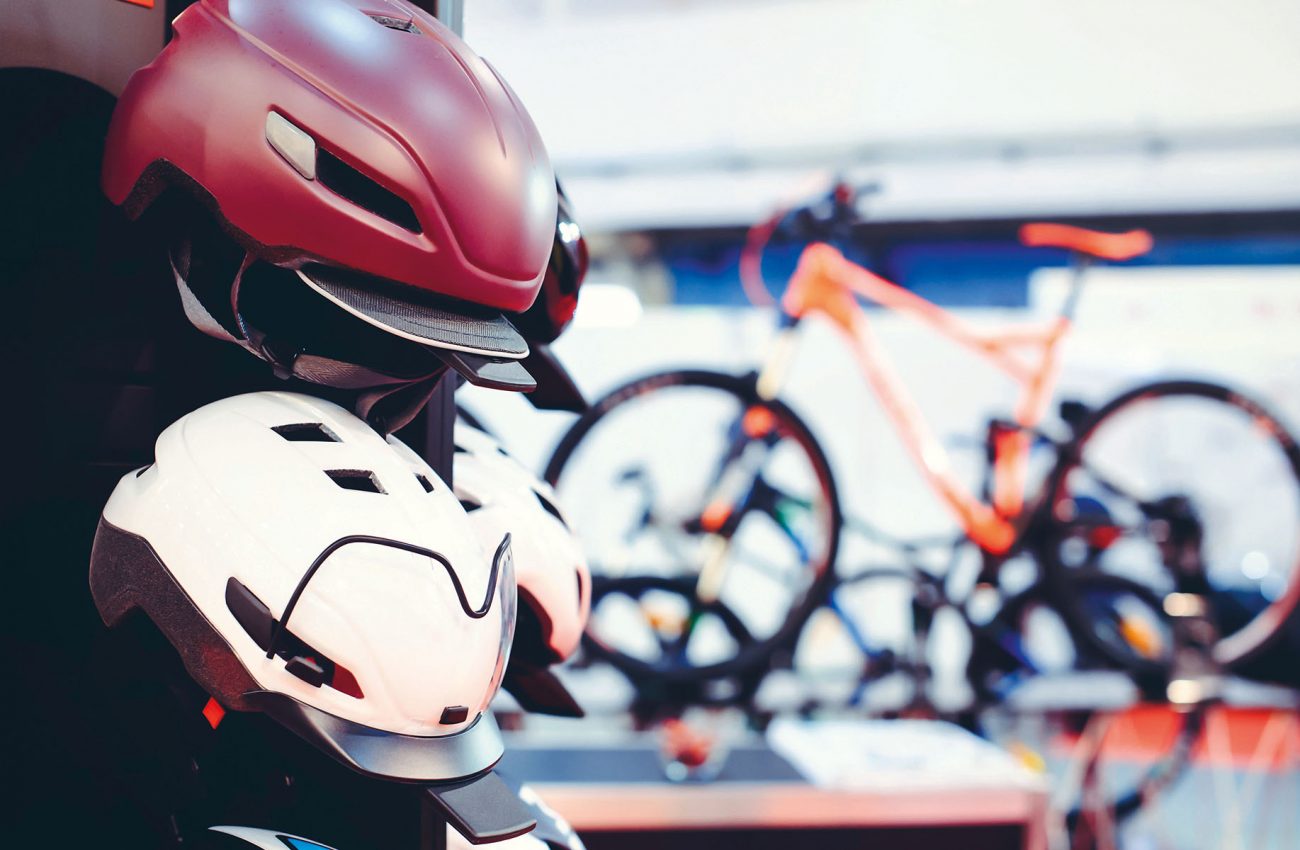 sale of a bicycle helmet on a bicycle background, safety on the