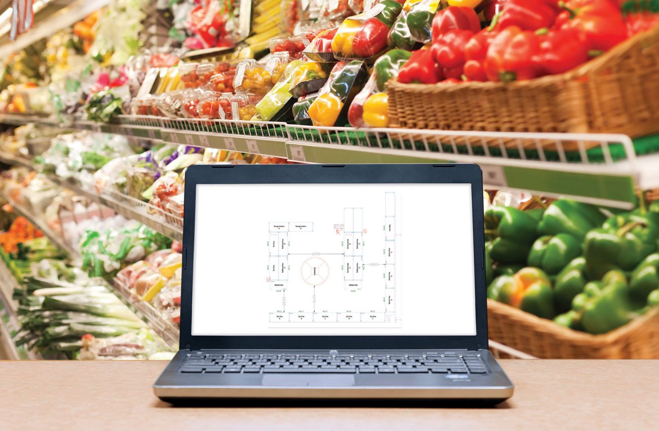 Laptop with analysis sale screen on table with blur warehouse ca